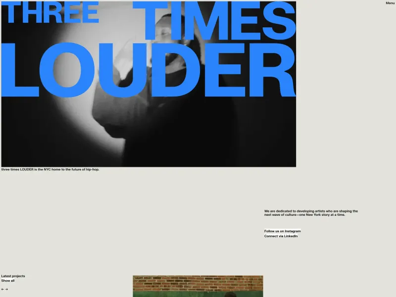 Screenshot of threetimeslouder.com with a huge blue logo saying "three times LOUDER" on top of a video with the subtitle "three times LOUDER is the NYC home to the future of hip-hop."